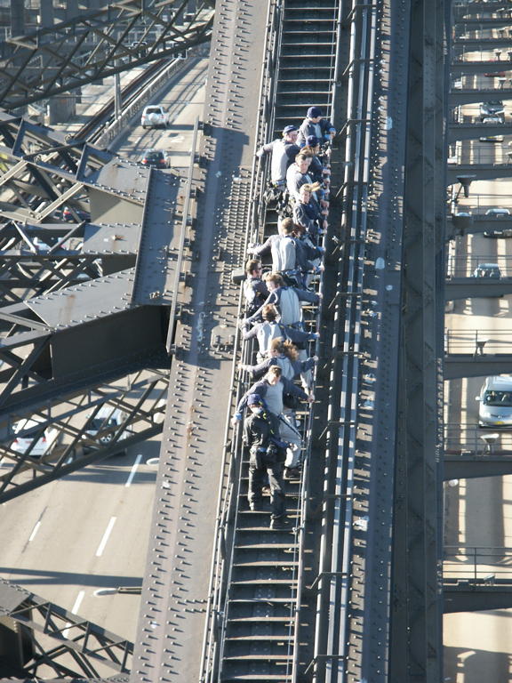 People traversing the harbour bridge as viewed from the tower